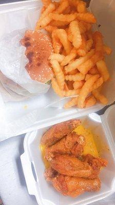 Cheese burger with 6 pcs Lemon pepper wings and French fries.