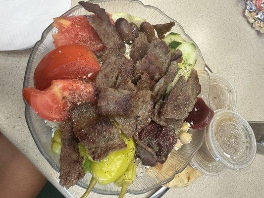 Medium Leo's Famous Greek Salad, medium with added gyro meat, comes with Greek pita, warmed on grill. Dressing was too vinegary.