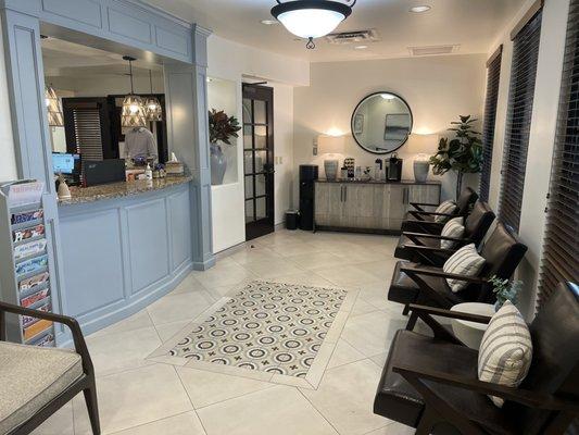 Reception area with coffee bar and magazines.