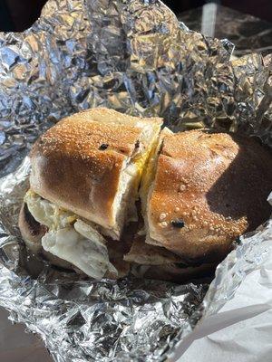 Sausage egg and cheese on a cinnamon raisin bagel