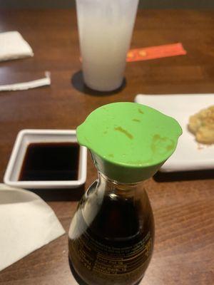 Dirty soy sauce containers. It was so nasty that I used a napkin to pick it up