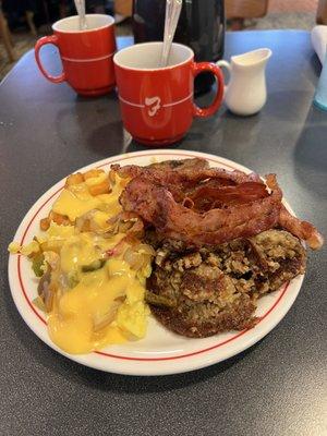 Frisch's breakfast bar is the best! Crispy bacon, crispy goetta, home fries and scrambled eggs covered in cheese sauce!