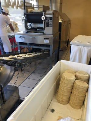 tortilla press in front of the bakery