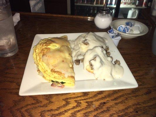 Omelette with spinach, peppers and ghost cheese and a side of biscuit and gravy