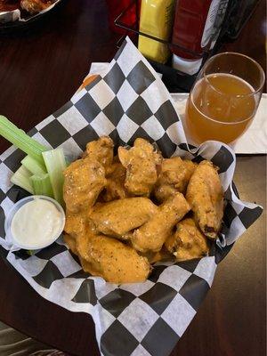 Cajun garlic buffalo wings with blue cheese dressing and celery. Bluemoon beer on the side.