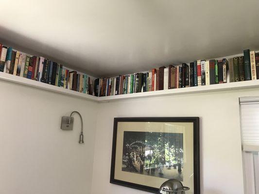 Ecky came up with the idea to put the corbels above the shelves, which came out beautifully