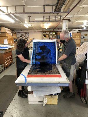 Master printer Jane Pagliarulo works with artist  Richard Harrington on a combination silkscreen and wood cut