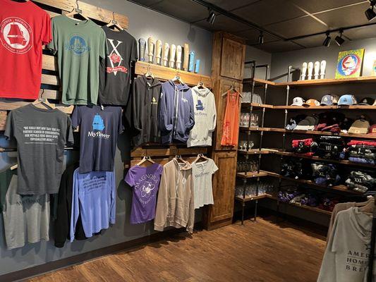 Souvenir shop with hats, shirts, glassware, sweatshirts and tap handles