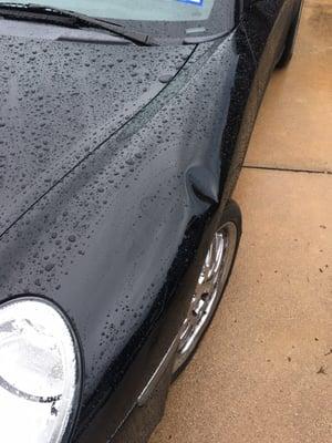 Basketball Goal blew over during storm and dented fender.