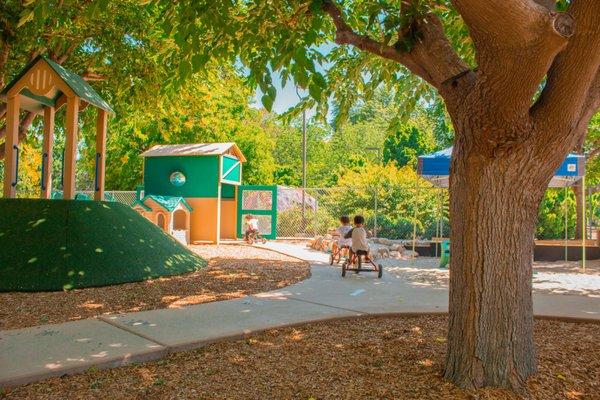 A variety of age-appropriate playground equipment allows children to practice and improve gross motor skills.