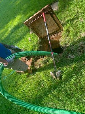 The opening to a septic tank for access to perform maintenance/pumping.