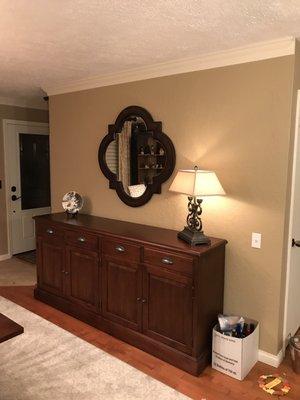 Dining room buffet, mirror and lamp.