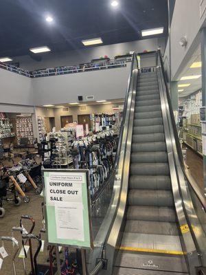 Escalator going up stairs