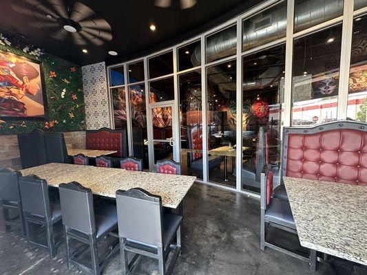 Indoor/outdoor seating has sliding window/door that opens fully