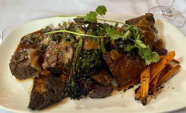 Roasted bison with portobello mushroom, broccolini, carrots & purple potatoes in gravy sauce