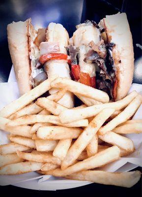 Philly cheesesteak with a side of fries