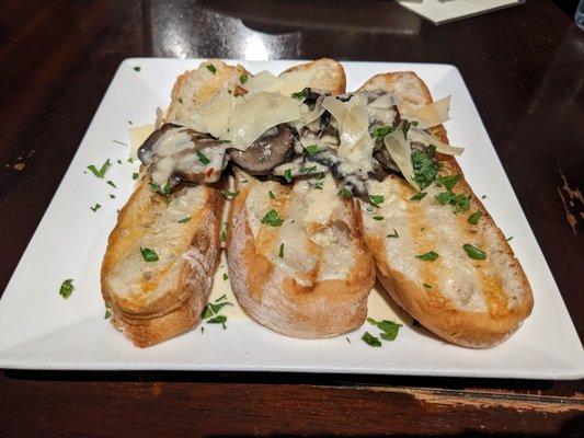 Mushroom Bruschetta: Sauteed crimini mushrooms, cream sauce, parsley, shaved parmesan on grilled ciabatta bread