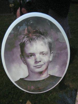 Close up of the picture on the grave of the boy that committed suicide in 2001 that OBI tried to cover up