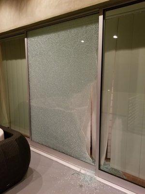 Broken sliding glass door (photo taken from outside)