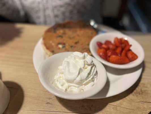 Chocolate chip pancakes with a side of fresh strawberries