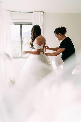 Helping brides into their gown on their big day!