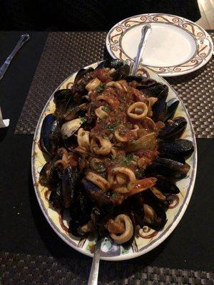 Bountiful seafood feast of zuppa di pesce, with sugary sweet tomato sauce