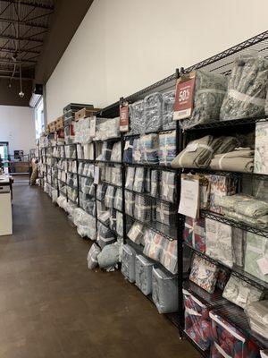 All the bedding that is unused and still being sold in the store, but is discounted to bring people into the outlet mall