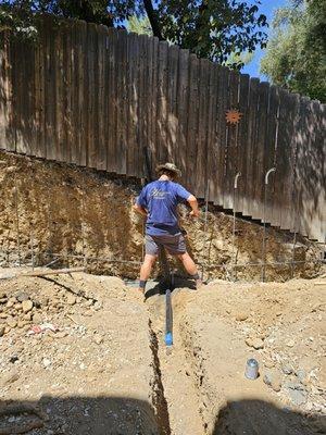 Trenching for conduit