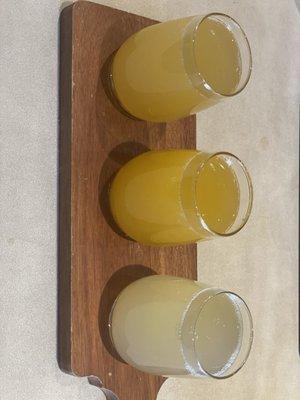 Mango, passion fruit and peach mimosa flight