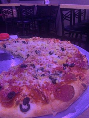 Build your own pizza:Half pepperoni half chicken with olives and banana peppers throughout.