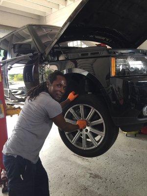 REX working on the brakes for a Range Rover.