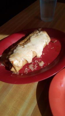 Nopalitos' Chile con carne chimichanga smothered in green. Too much cheese and too little Chile. But, it was good.