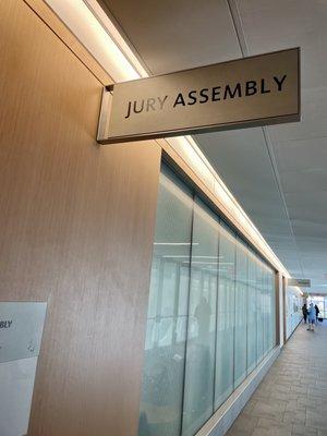 Signage above the jury pool room where you wait and wait to hear if your name might be called