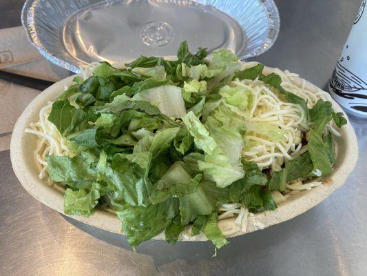 Chicken bowl with brown rice, cheese, sour cream, extra corn and lettuce