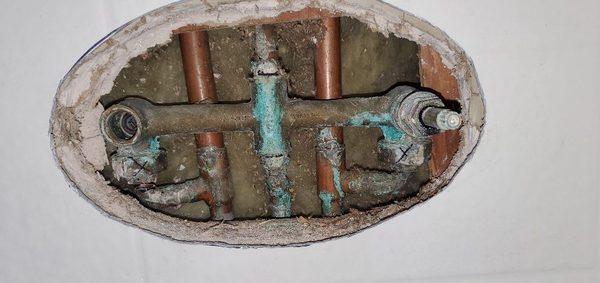 Old corroded two handle shower valve