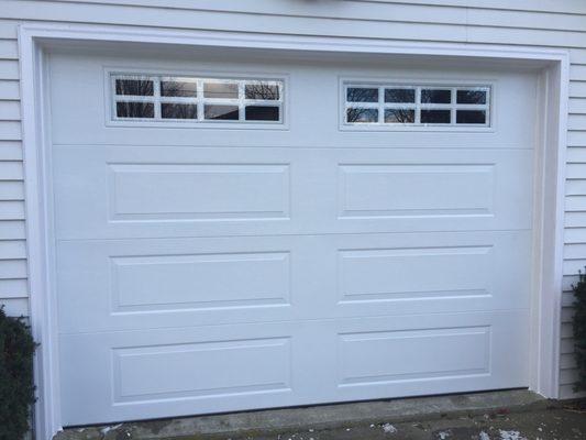 Long panel garage door with windows installation