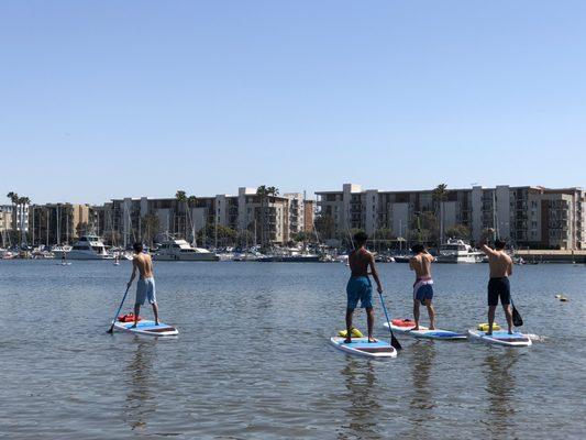 Kids paddle boarding out!