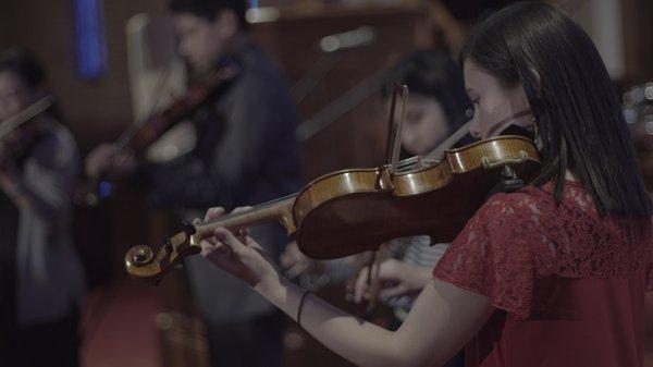 Violin Instructor with her students at Christmas Recital 2018.