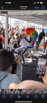 Gyrating clowns into a group of young kids.