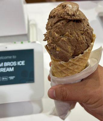 Chocolate PB Ice Cream on a fresh waffle cone