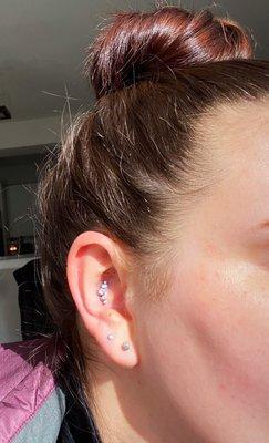 Conch piercing and upper lobe piercing