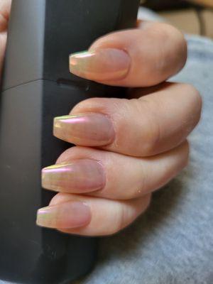 Clear with a pink nail powder. Perfect shape, perfect length. All the way to the edge.