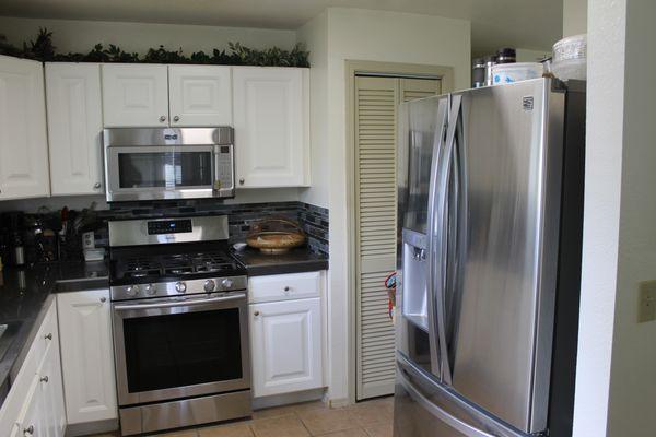 Modern kitchen with 24 X 24 tiles and super small grout lines that are easy to keep clean