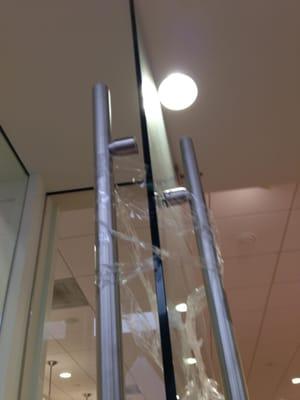 Mall front door before Your-Locksmith.com repaired the door handle