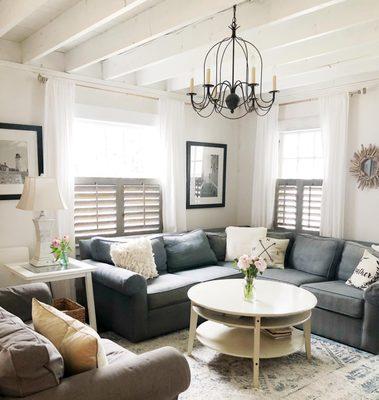 Farmhouse Cottage amplified...Rustic Reclaimed Wood Shutters take this Living Room from stunning to stellar.