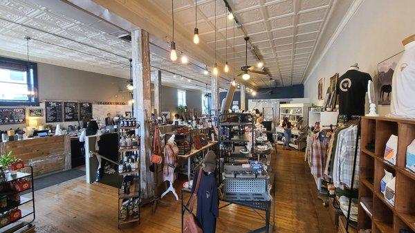 Boutique area + coffee counter. You can see the stairs to go downstairs to the bathroom in between the two. (photo center left)