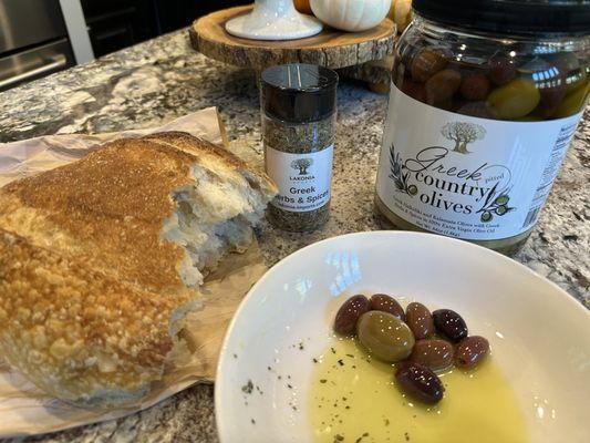 Fresh sourdough, Lakonia Greek seasoning and olives.