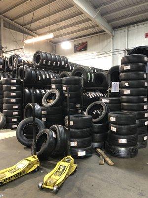 A ton of used and new tires ranging in prices by brand and condition