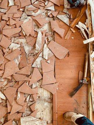 During demolition. They removed the old tiles & old laminate flooring throughout the home.