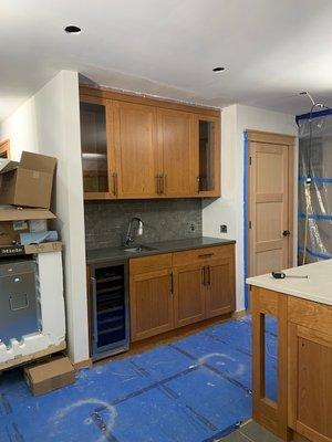 New wetbar quartz counter and backsplash tiles